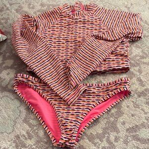 Athleta Vibrant Striped Zip-Up Top and swim bottoms